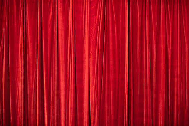 istock Red curtain in theatre. 1306803550