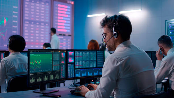 istock Male trader using computer to trade stocks 1306803551