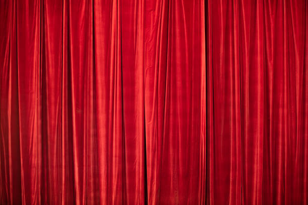 istock Red curtain in theatre. 1306803581