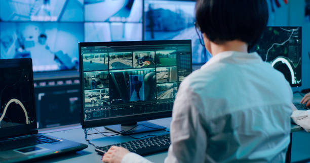 istock Woman working in modern security center 1306803589