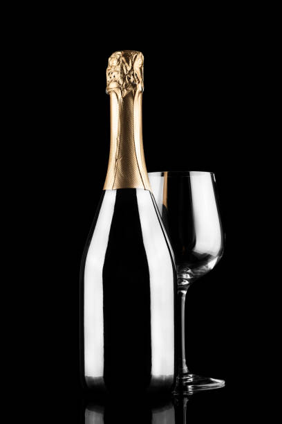 istock Champagne bottle silhouette and glass isolated on black background 1306803616