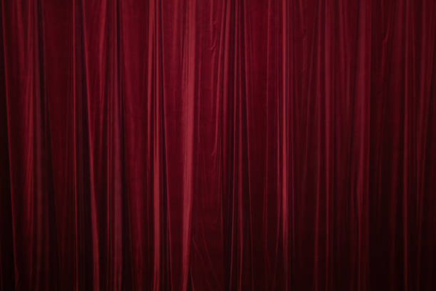 istock Red curtain in theatre. 1306803678