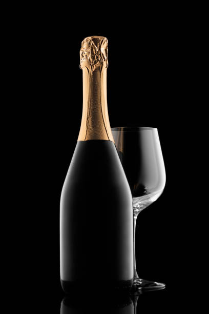 istock Champagne bottle silhouette and glass isolated on black background 1306803708
