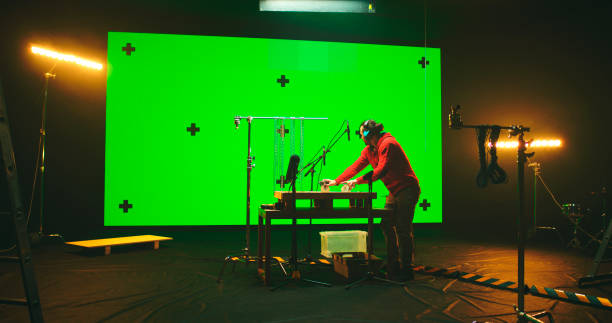 istock Sound designer working against chromakey screen 1306803720