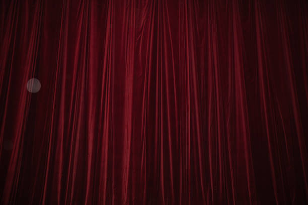 istock Red curtain in theatre. 1306803763