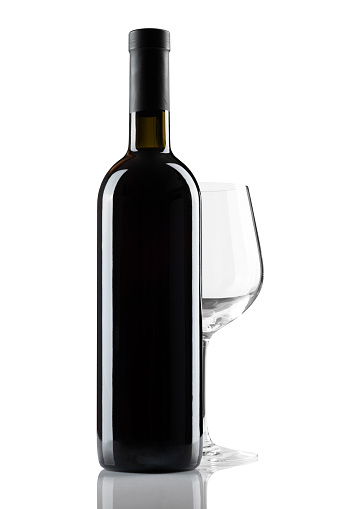 bottle of red wine without label and glass isolated on white background