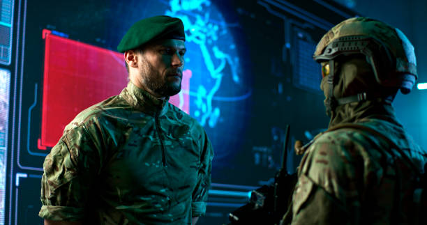 istock Male commander speaking with soldier in nuclear attack control center 1306804068