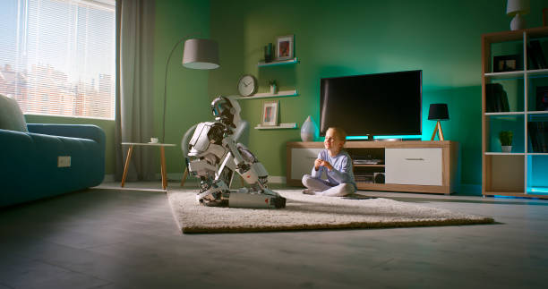 Girl speaking with robotic friend at home Zoom in view of girl sitting on carpet near TV set and talking with android while resting at home in weekend real time stock pictures, royalty-free photos & images