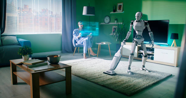 istock Robot cleaning carpet near owner using tablet 1306804834