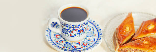 istock Turkish coffee and baklava on a light background. Selective focus. 1306805189