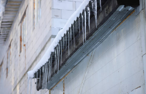 istock Many icicles twisting from the side of the roof 1306809343