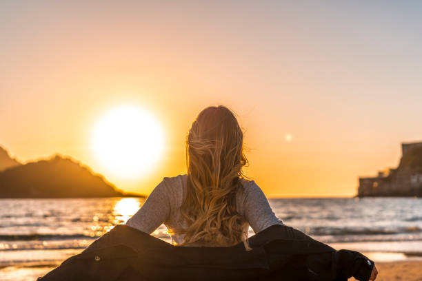 istock A smiling blonde in a Lifestyle session on a beach 1306811692