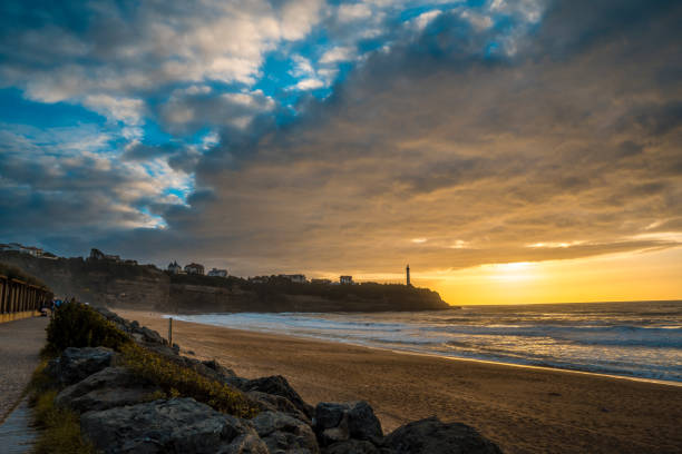 sunset at strand der kleinen cambre d 'amour beach in biarritz - bamburgh northumberland england white beach stock-fotos und bilder