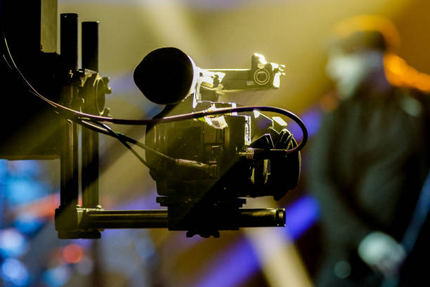 istock Blur - Photographer video recording activity within the event 1306813355