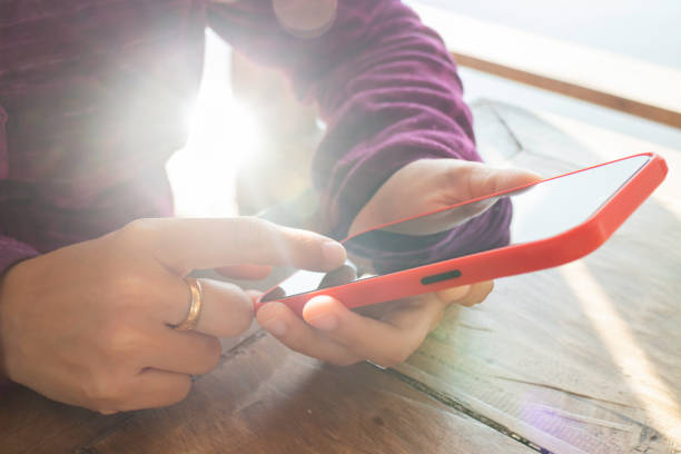istock Woman using phone social connection 1306816261