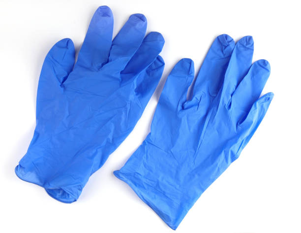 istock Medical gloves new blue white background 1306816475
