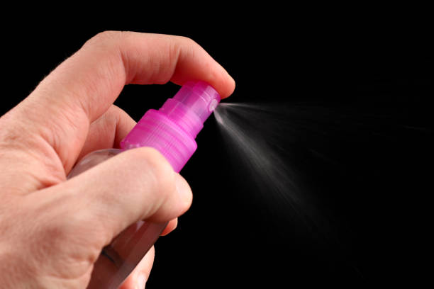 istock Antiseptic or hand spray closeup dark background 1306816489