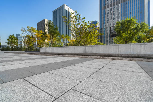 istock empty pavement and modern buildings in city 1306816816