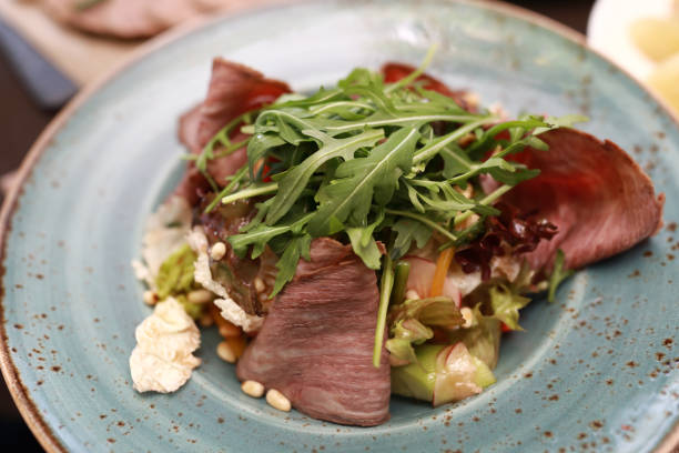 istock Meat salad on plate 1306821238