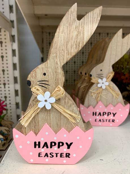 istock Easter wooden decoration with rabbits bunny 1306823735