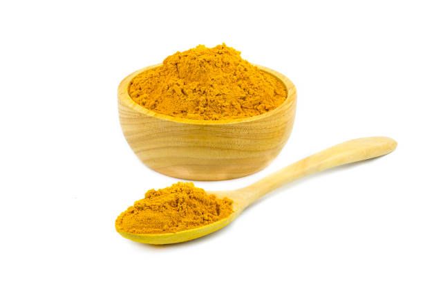 istock Turmeric (Curcuma longa Linn) rhizome (root) sliced with green leaves isolated on white background. 1306825662