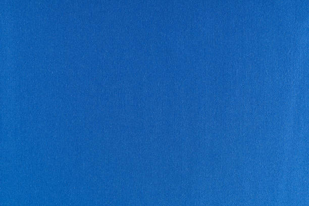 istock flat surface of blue fabric for sewing clothes, background, texture 1306825921