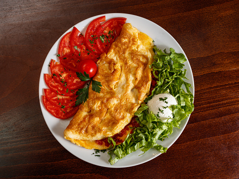 Omelette breakfast with tomato and lettuce