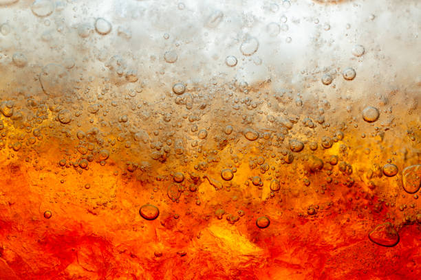 istock Macro soft drinks,Cola close-up,Ice, Bubble, Backgrounds, Ice Cube, Abstract Backgrounds,Ice cold drink,Detail of Cold Bubbly Carbonated Soft Drink with Ice 1306829844