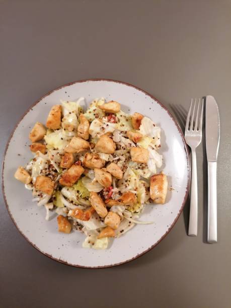 istock Salad with quinoa and fried chicken 1306831792