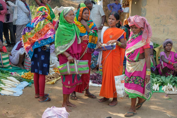 Bastar, India - March 2021: Adivasi women shopping at the weekly market in Bastar on March 4, 2021 in Chhattisgarh, India.