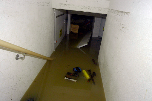 building in a flooded area after heavy rainfalls, muddy water