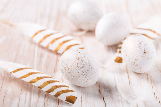 istock Easter eggs with feathers and pussy willow branch. Easter decoration. 1306843512