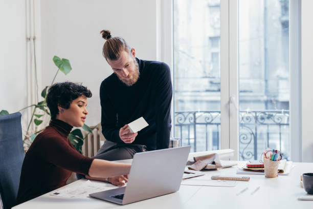istock Two Young Architects Working Together on a New Design 1306844397