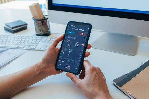 istock Anonymous Finance Expert Analyzing Financial Charts on a Smartphone 1306844435
