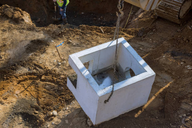 istock Water drainage at road construction site the square concrete manholes installed 1306844562