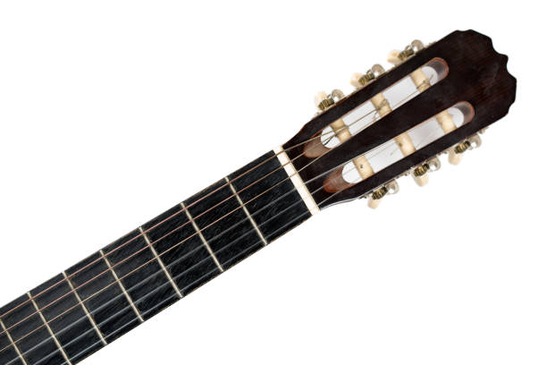 istock Top of six-string guitar neck isolated on white background. 1306845710