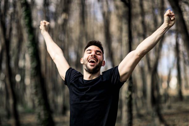 istock Young Hiker enjoying nature, arms outstretched for positive emotion 1306848098