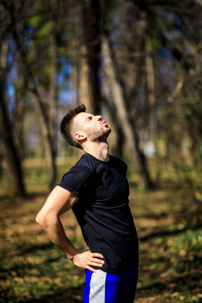 istock Sport man feeling backache outdoors 1306848182
