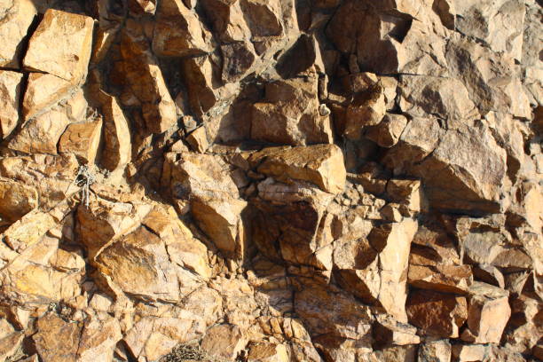 istock Weathered Rocks Background with Lichen Full Frame of Cliff 1306849317