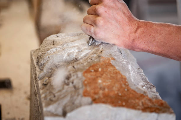 istock Close-up of Mason Working on a Sculpture With Chisel 1306849824