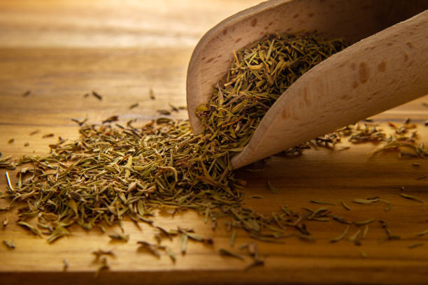 istock A wooden spoon full of dried thyme. 1306849959
