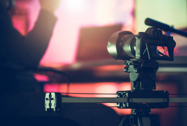 istock Digital SLR Video Camera Moving on a Slider 1306850565