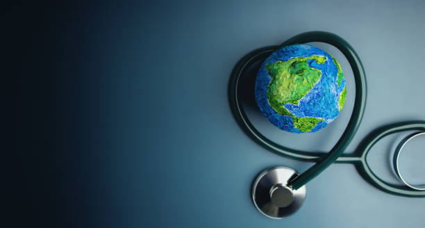 World Health Day. Global Health Awareness Concept. Handmade Globe inside Stethoscope as Heart Shape. Green Environment to Love and Care stock photo