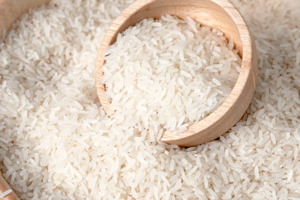 istock White rice in wooden bowl on rice background. (Rice Kor. 43) 1306854894