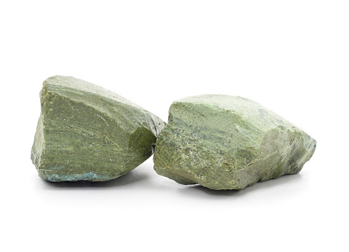 Two green onyx stones isolated white background.