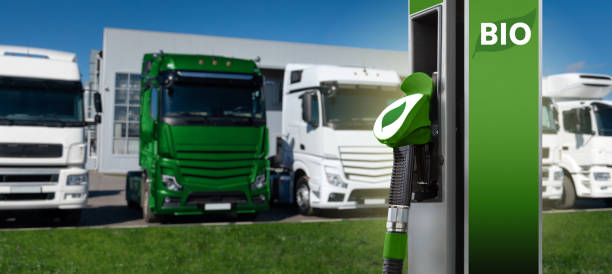 Biofuel station on a background of trucks Biofuel filling station on a background of trucks biofuel photos stock pictures, royalty-free photos & images