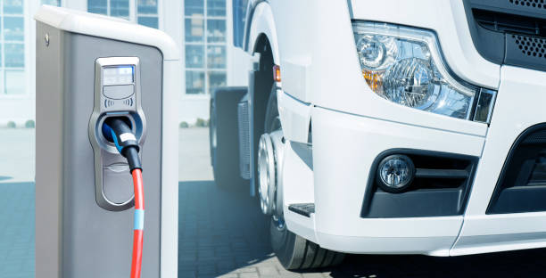 Electric vehicles charging station on a background of a truck Electric vehicles charging station on a background of a truck. Concept commercial land vehicle stock pictures, royalty-free photos & images