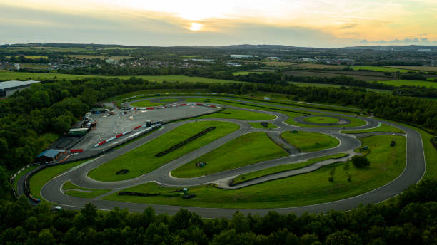 Aerial drone view of a go kart car race track circuit at sunset Epic drone shot of the circuit Three Sisters Race Circuit located near the city of Wigan motor racing track photos stock pictures, royalty-free photos & images