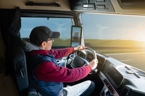 istock Man driving a truck 1306857288