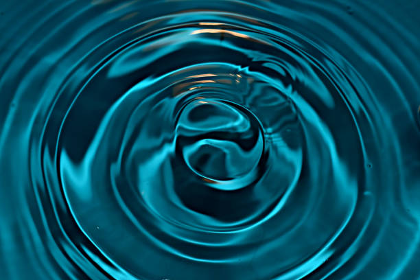 istock A drop of water left circles on the water. 1306857927